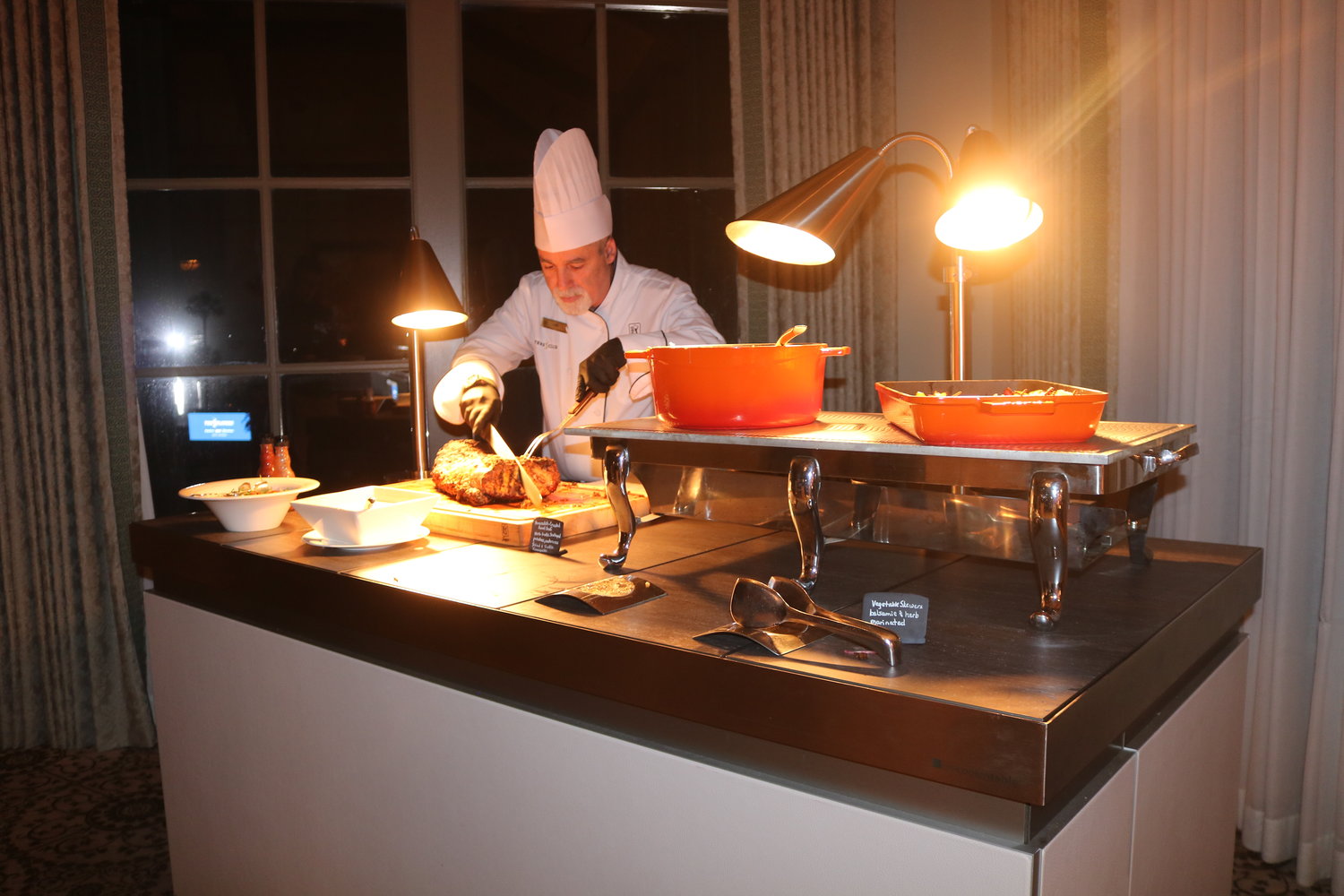 A chef prepares food during the event.